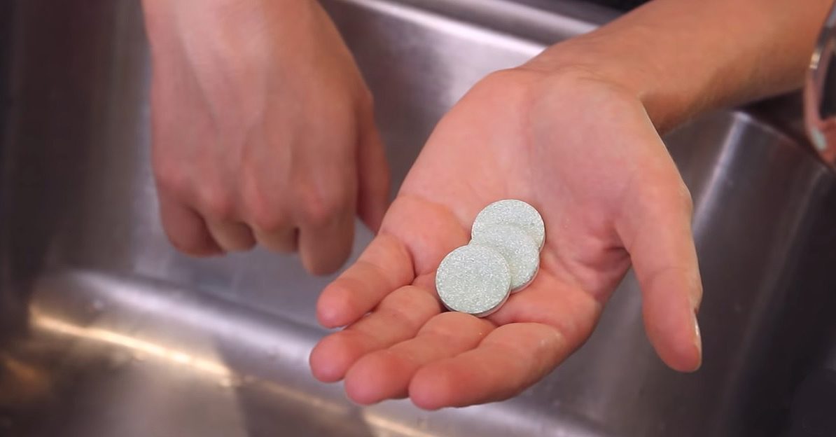 chlorine dioxide tablets in hand.