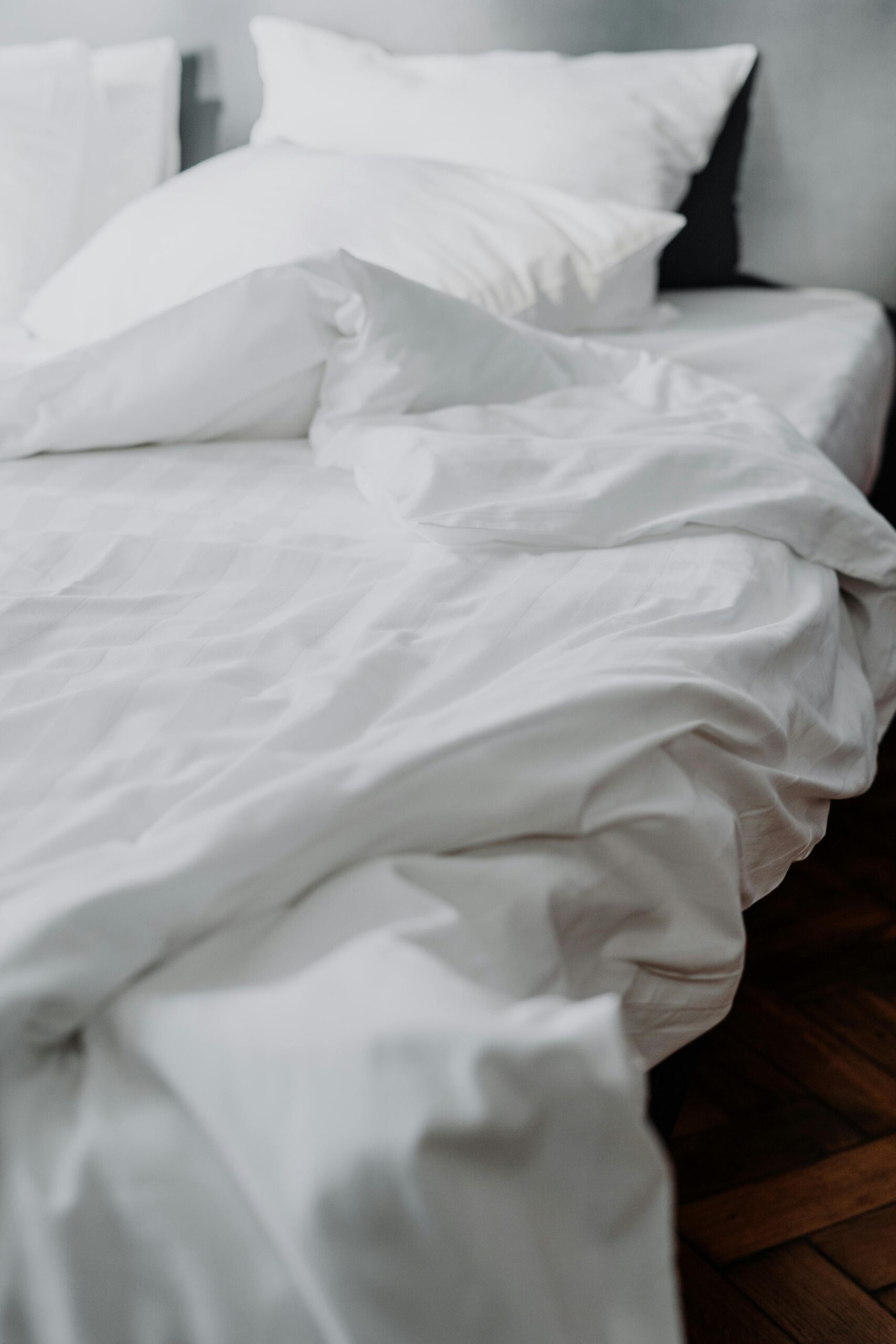 Start by stripping all bedding—sheets, blankets, pillowcases, and mattress protectors.
