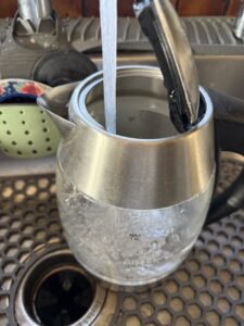 Fill the Kettle Halfway with Warm Water